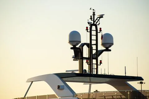 Closeup view of navigation radar system antennas yacht on blue sky background Stock Photos