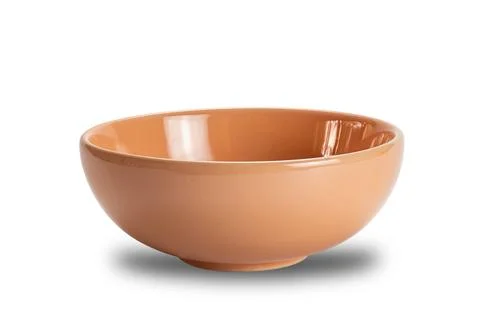 Closeup view of new empty brown ceramic bowl isolated on white background. Stock Photos