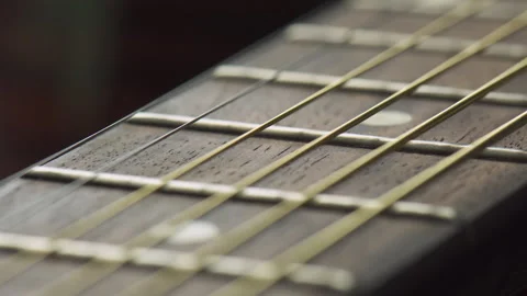 Closeup view of new strings on an acoustic guitar Stock Footage 321527343