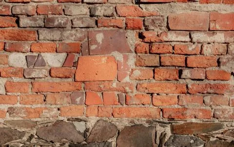Closeup view on old brick wall of abandoned building Stock Photos