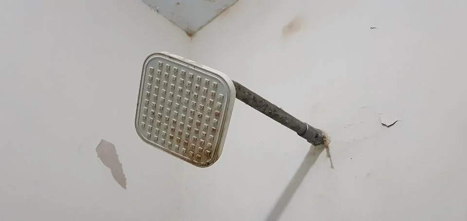Closeup view of an old rustic plastic shower Stock Photos