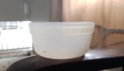 Closeup view of an old white plastic bowl Stock Photos