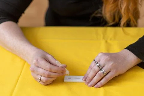 Closeup view of one of the steps of preventive rapid control of Covid-19 by a Stock Photos