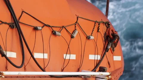 Closeup view of orange color freefall lifeboat. Stock Footage 140390478