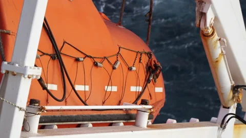 Closeup view of orange color freefall lifeboat. Stock Footage 140645552