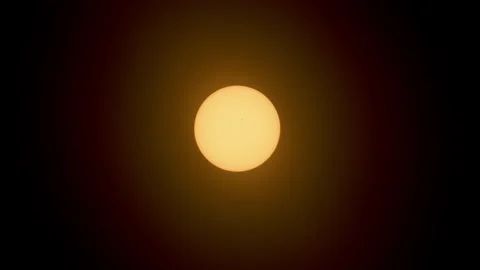 Closeup view of the orange sun before eclipse in center of the frame Stockbeeldmateriaal 271368444