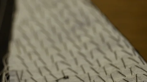 Closeup view of a pad stitched lapel. Pad stitches are a type of running stitch Stock Footage 127332416