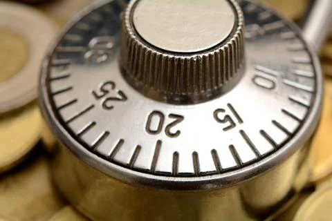 Closeup View of Padlock on Coins Stock Photos