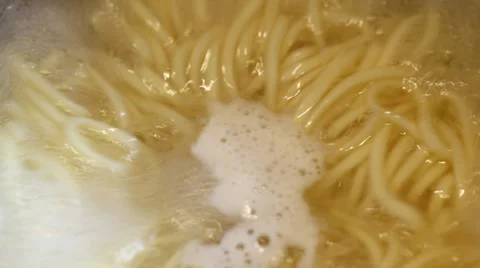 Closeup view of pasta boiling in water. Video stock 35574750