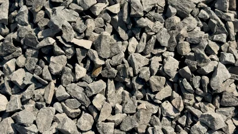 Closeup view of a pile of gray stones with varied shapes and textures in na.. Stock-Footage 339296468