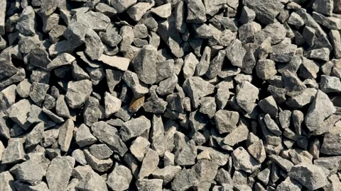 Closeup view of a pile of rough gray stones with varied shapes and textures.. Vidéo 339296476