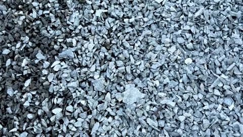 Closeup view of a pile of small gray gravel stones in various shapes and size Stock Footage 339295846