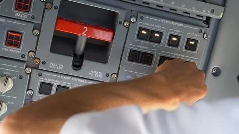Closeup view of a pilot testing the ice protection system in an aircraft Stock Footage 115093701