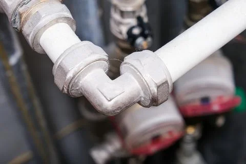 This is a closeup view of a pipe that has a broken elbow joint Stock Photos