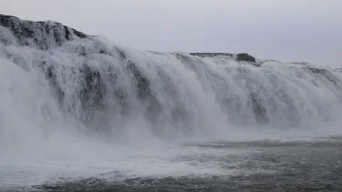 Closeup view of powerfull stream of Icelandic waterfall in winter season Vídeo Stock 162990407