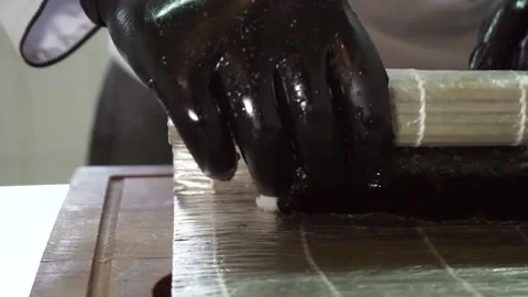 Closeup view of process of cooking sushi.sushi chef prepares Japanese sushi Stock Footage 132037551