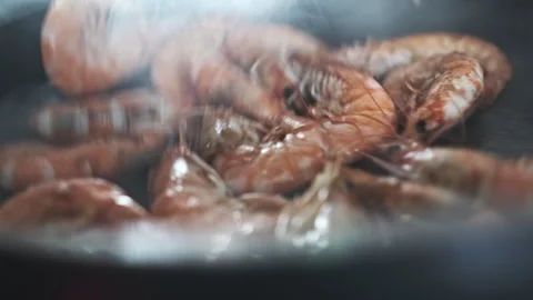 Closeup View of Professional Chef Cooking Tasty Seafood Prawns with Steam and Stock Footage 273130723