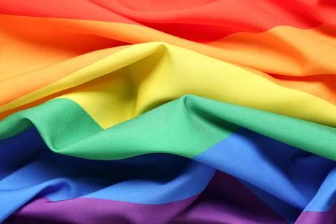 Closeup view of rainbow flag as background. LGBT concept Stock Photos
