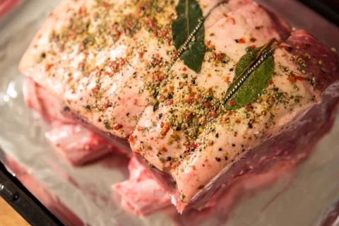 Closeup view raw beef cross rib chunk on oven tray with foil Photos