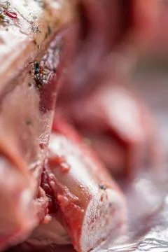Closeup view raw beef cross rib chunk on oven tray with foil Fotos de archivo