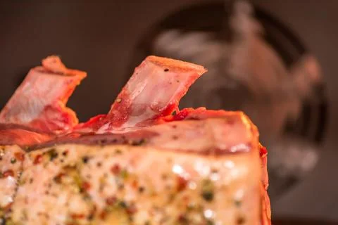 Closeup view raw beef cross rib chunk on oven tray with foil inside oven Fotos de archivo