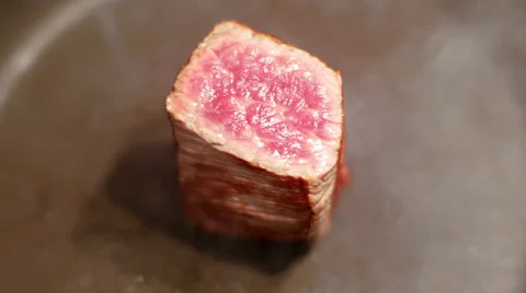 Closeup view of raw beef meat frying Video stock 65649180