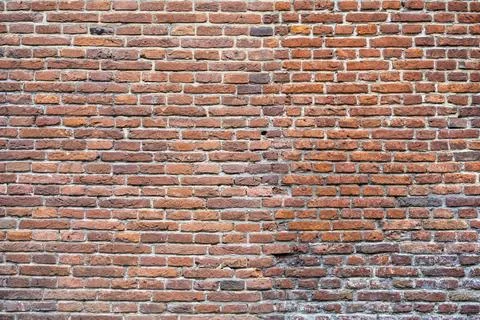 Closeup view of the red wall. Abstract pattern of a brick wall Stock Photos