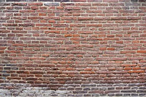 Closeup view of the red wall. Abstract pattern of a brick wall Stock Photos