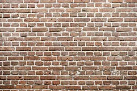 Closeup view of the red wall. Abstract pattern of a brick wall Stock Photos