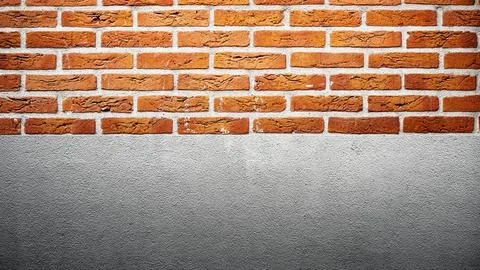 Closeup view of the red wall. Abstract pattern of a brick and cement wall Stock Photos