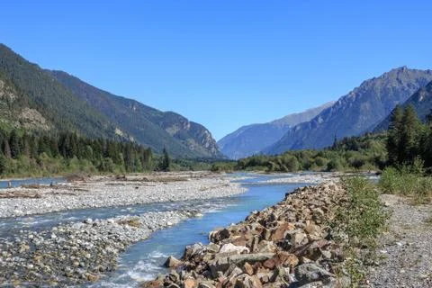 Closeup view river scenes in mountains of national park Dombai, Caucasus, Rus Stock Photos
