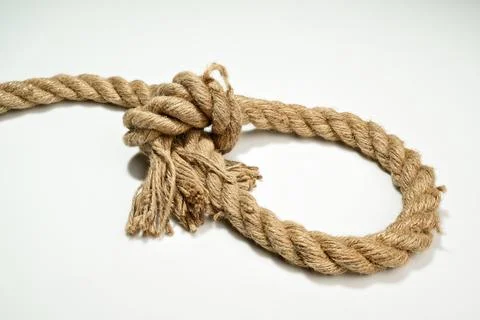 Closeup view of ropes string with a knot isolated over a white background Stock Photos