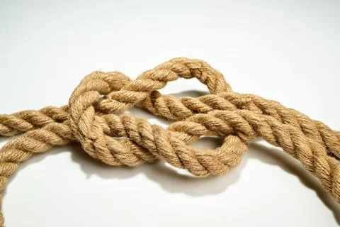 Closeup view of ropes string with a knot isolated over a white background Stock Photos
