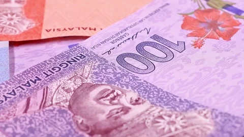 Closeup view of rotating brand new Malaysian ringgit (MYR) banknotes. Stock Footage 297164777