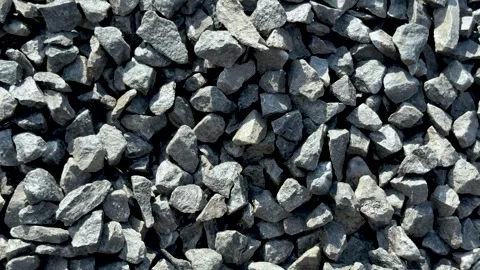Closeup view of rough gray stones in various shapes and sizes forming a tex.. Stock-Footage 339369021