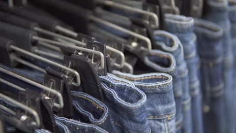 Closeup view of row of jeans at a mass market store Stock Footage 284707361