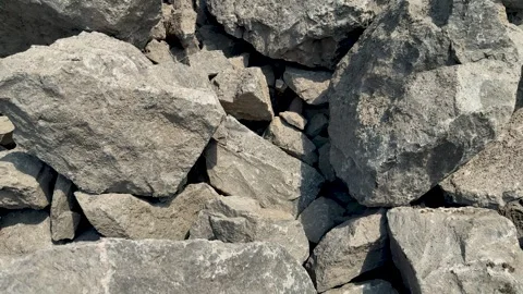 Closeup view of rugged gray rocks with varied textures and shadows in natur.. Stock-Footage 339296202
