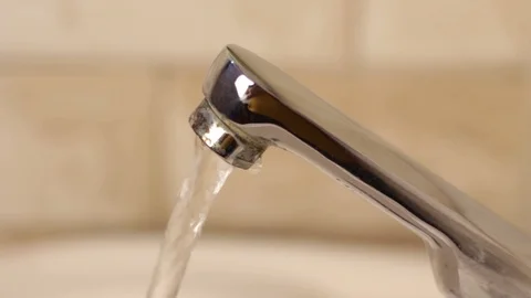 Closeup view of running water tap in wash basin Stock-Footage 121704416