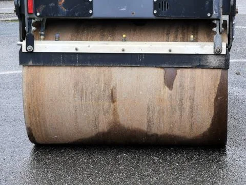 Closeup view of a rusty roll compactor used for road repair Stock Photos
