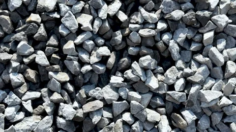 Closeup view of scattered gray and white gravel stones in natural outdoor s.. Vidéo 339369023