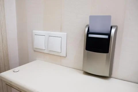 Closeup view of a security key card that controls power in a hotel room. Stock Photos