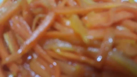Closeup view with selective focus of boiled carrots. Stock Photos