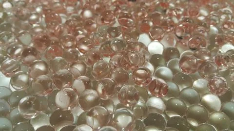 Closeup view with selective focus of shiny glittering orbeez or colorful wate Stock Photos