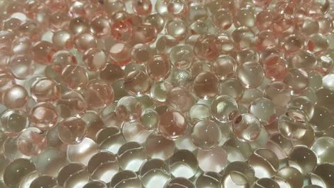 Closeup view with selective focus of shiny glittering orbeez or colorful wate Stock Photos