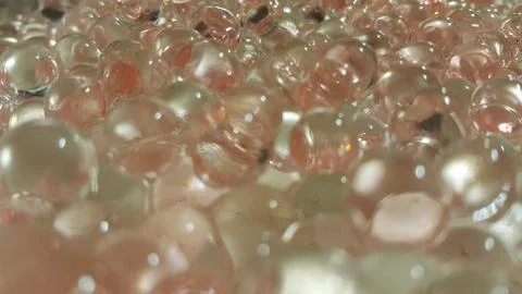 Closeup view with selective focus of shiny glittering orbeez or colorful wate Foto stock