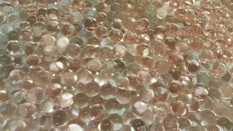 Closeup view with selective focus of shiny glittering orbeez or colorful wate Stock Photos