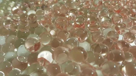 Closeup view with selective focus of shiny glittering orbeez or colorful wate Stock Photos