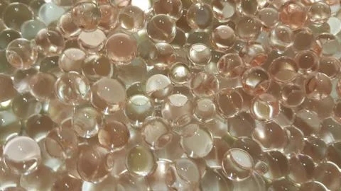 Closeup view with selective focus of shiny glittering orbeez or colorful wate Stock Photos