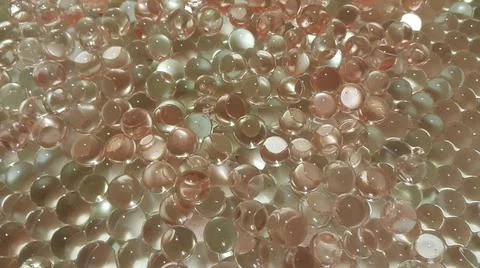 Closeup view with selective focus of shiny glittering orbeez or colorful wate 스톡 사진