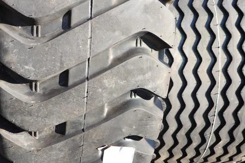 A closeup view showcasing the intricate pattern of a truck tire tread design and Stock Photos